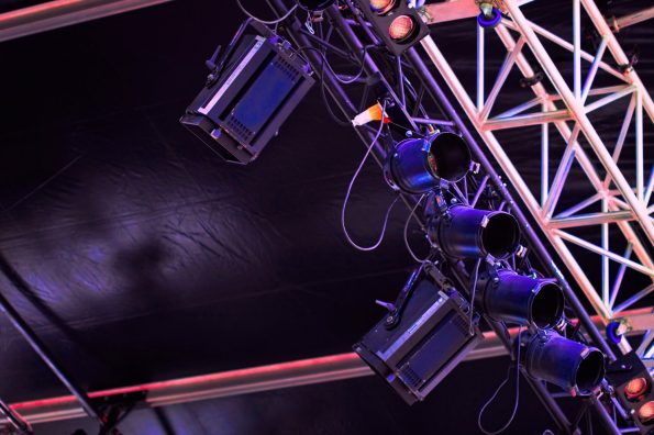 Spotlights and metal beam on stage before the show